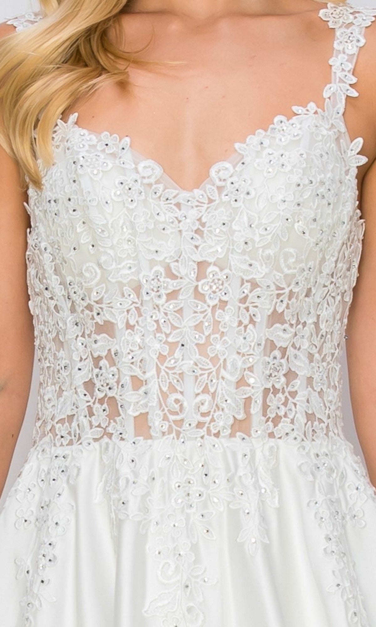 Close-up of the Cinderella Couture 8041J long formal dress, showcasing its white lace corset bodice with floral embroidery, bead accents, and sheer paneling; ideal for bridal celebrations, this gown features thin straps and a flowing satin white formal skirt.